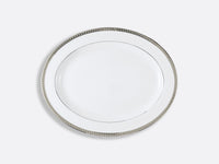 A Bernardaud Athena Platinum Dinnerware plate with a silver rim, viewed from above on a light gray background.