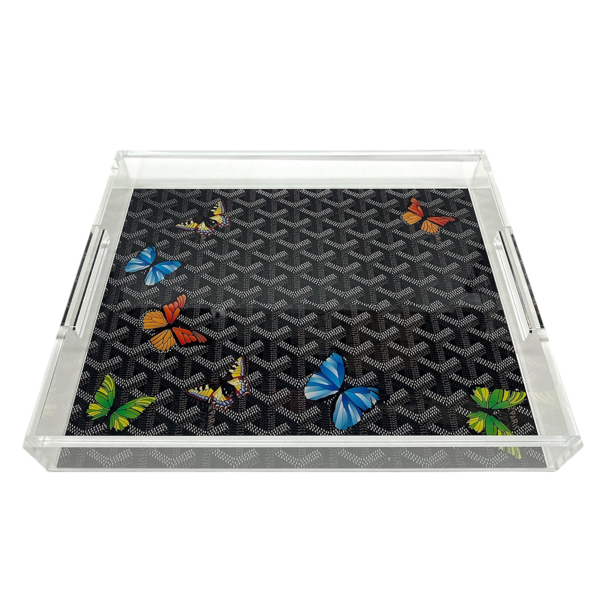 The Eye Candy Grandeur Tray - Maison Black w/ Butterflies 14 x 18 is a clear acrylic tray with silver handles and a black patterned base featuring vibrant butterflies—ideal as a stylish decorative serving tray for any event.