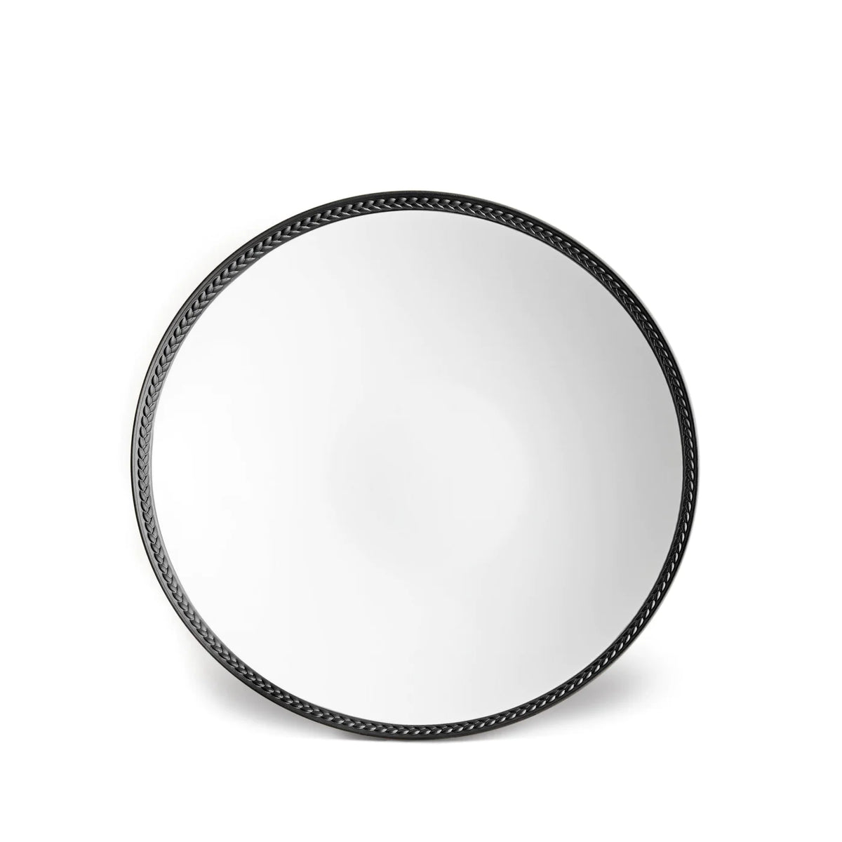 A round mirror with a black, braided frame accents any space and pairs beautifully with L'Objet Soie Tressée Black Dinnerware for a refined, sophisticated dining atmosphere.