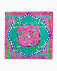 Oh My Mahjong’s Mahjong Mats square scarf features a vibrant pink, green, and blue design inspired by Mahjong mats, with birds, flowers, leaves, and ornate borders arranged in a symmetrical pattern.
