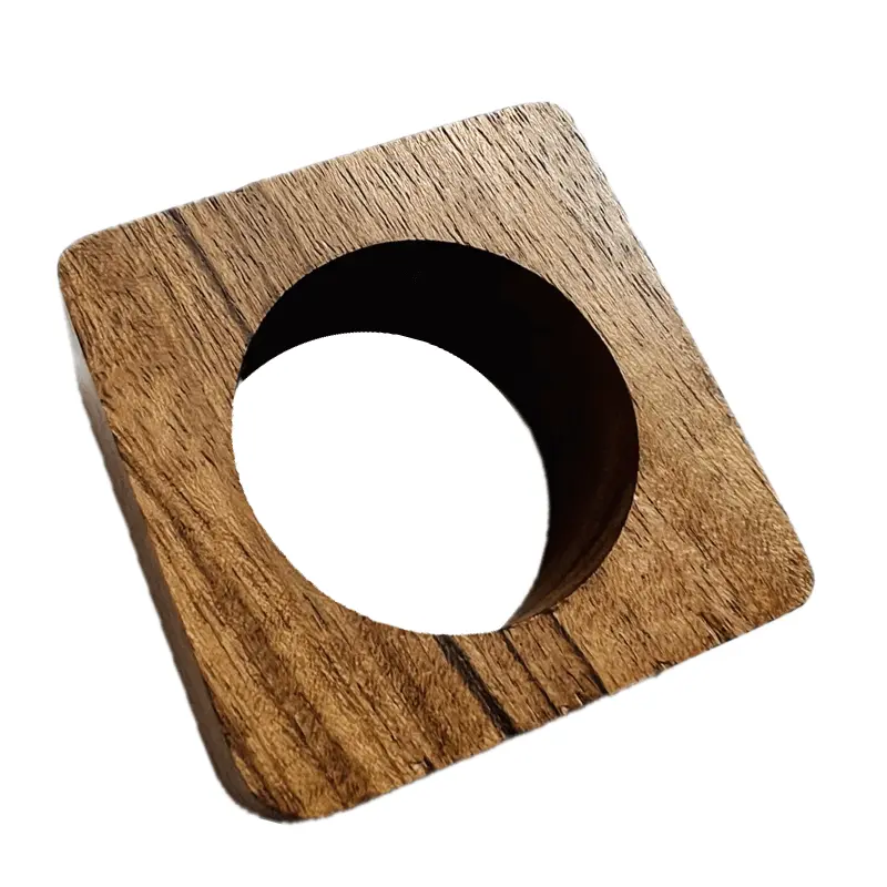 The Mocha Napkin Ring Brown Set of 4 by Von Gern Home features square wooden rings with a large circular center, displayed at an angle on a white background—these distinctive napkin rings highlight the beauty of natural wood in a minimalist, geometric design.