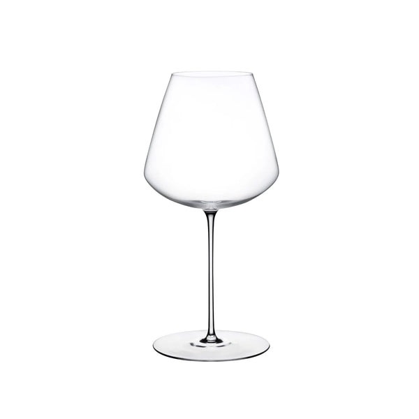 A clear Stem Zero Elegant Red Wine Glass by Nude Glassware, featuring a wide bowl and thin stem, is centered on a white background.