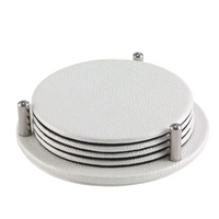 The Bodrum Stingray Coaster Set includes four round, white textured coasters stacked in a matching holder with four metal posts and an elegant metallic finish.
