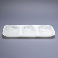 The Nashi Home Swirl Resin Classic 3 Section Tray is a rectangular white tray with three separate compartments, made from food-safe, marbled resin. Its shatter-resistant design is showcased on a plain gray surface.