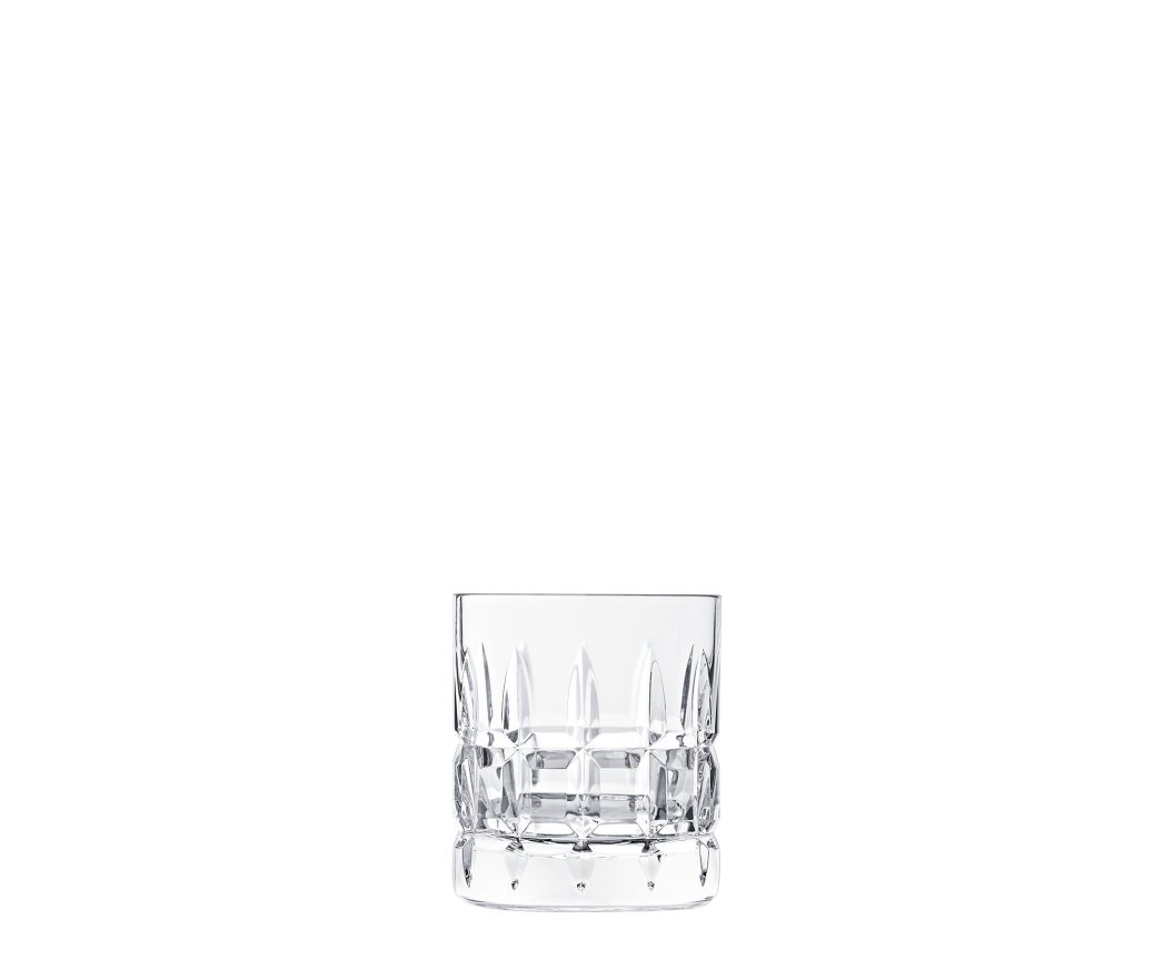 A clear, empty crystal glass from the Saint-Louis Manhattan Barware collection featuring a textured cut pattern is centered on a plain white background.