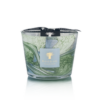 The Leaves Marius Candle by Baobab is a decorative hand-blown glass candle with green and white swirls, inspired by Provence, and finished with a signature Baobab ribbon.