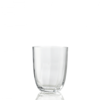 The Idra Tumbler Optic by Nason Moretti is a clear glass with smooth, optic-textured sides, centered on a white background and reflecting subtly at its base.