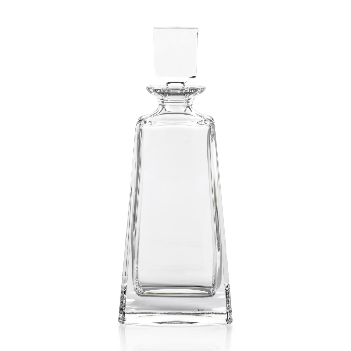 The Kelsey Crystal Decanter by Zodax is displayed standing upright against a white background, showcasing its clear, empty form with a tall, tapered rectangular silhouette, smooth surfaces, and a square stopper—an elegant addition to any home bar or barware collection.