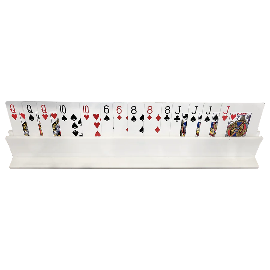 A row of playing cards stands upright in the Canasta Rack by Canasta Sets, displaying different suits—ideal for organizing cards and pairing with other canasta accessories.