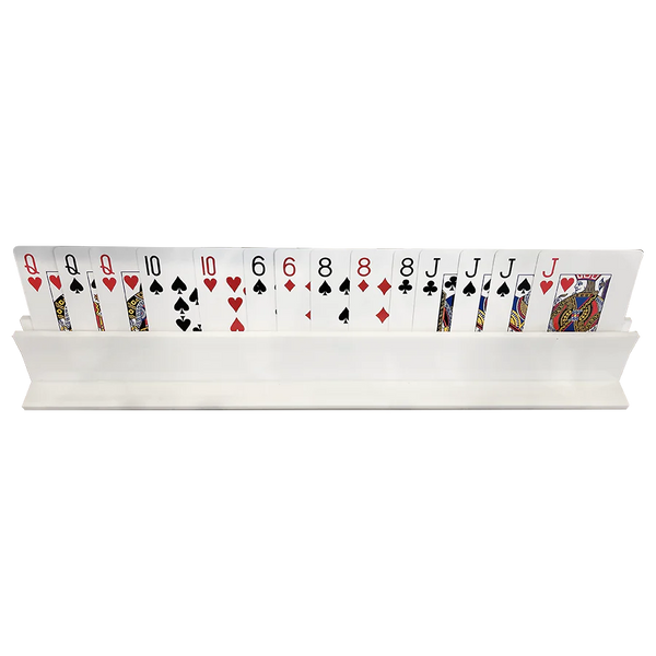 A row of playing cards stands upright in the Canasta Rack by Canasta Sets, displaying different suits—ideal for organizing cards and pairing with other canasta accessories.
