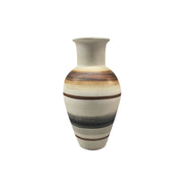 The Carina Vase - Medium by Mood Dekor is an artisanal ceramic piece with a wide body and narrow neck, showcasing horizontal brown, black, and tan stripes on a cream background for a modern earthy touch.