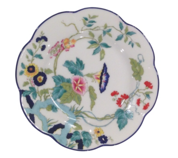 The Royal Limoges Nymphea Paradis Bleu plate features a scalloped edge and vibrant pink, yellow, blue, and green floral design with a thin blue rim—an ideal collectible for Limoges dinnerware enthusiasts.