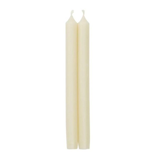 The Caspari Crown White Taper Candle Set features two cream-colored, smokeless and dripless candles standing upright side by side with untouched wicks, set against a plain white background.