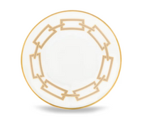 A round white plate from the Ginori 1735 Catene Cachemire Beige Dinnerware collection, featuring a beige geometric pattern and a thin gold edge inspired by Gio Ponti.