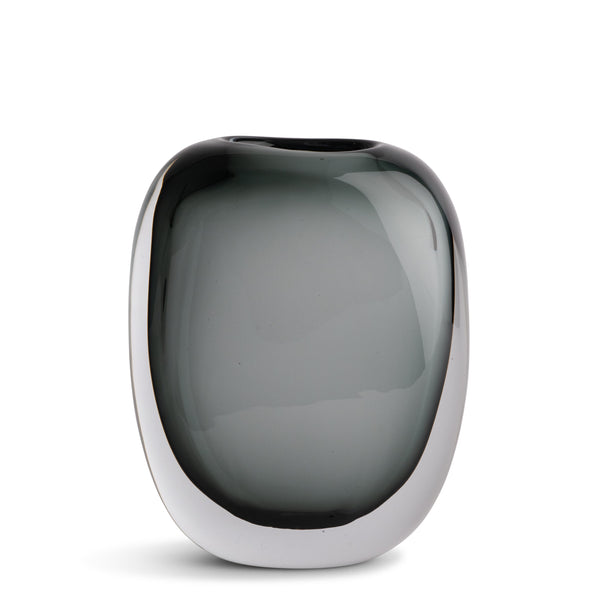 The Paul Vase by FlowDecor Inc. features smooth, rounded smokey grey glass and sits elegantly on a white background—an ideal accent for modern home décor.