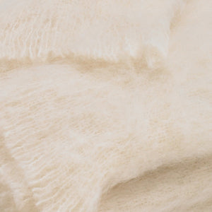 Close-up of the Brushed Cream Alpaca Throw by Lands Downunder, showing its soft, fluffy texture and visible fibers—crafted in New Zealand for warmth and comfort.