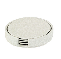 The Bodrum Skate Coaster Set of 4 features round textured white coasters crafted from phthalate-free vinyl, neatly stacked in a matching holder with an open side for easy access—combining style and safety for your tabletop.