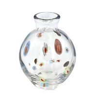 Introducing the Cello Dots Bud Vase - Clear by Abigails, a round glass vase featuring a narrow opening and adorned with colorful, oval-shaped spots in blue, red, green, and brown.