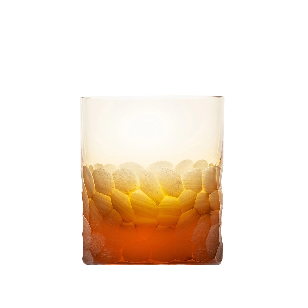 The Moser Pebbles DOF 370 ml is a hand-blown, lead-free Czech crystal whisky glass with a textured pebble base that fades from amber orange to clear, shown empty against a white background.
