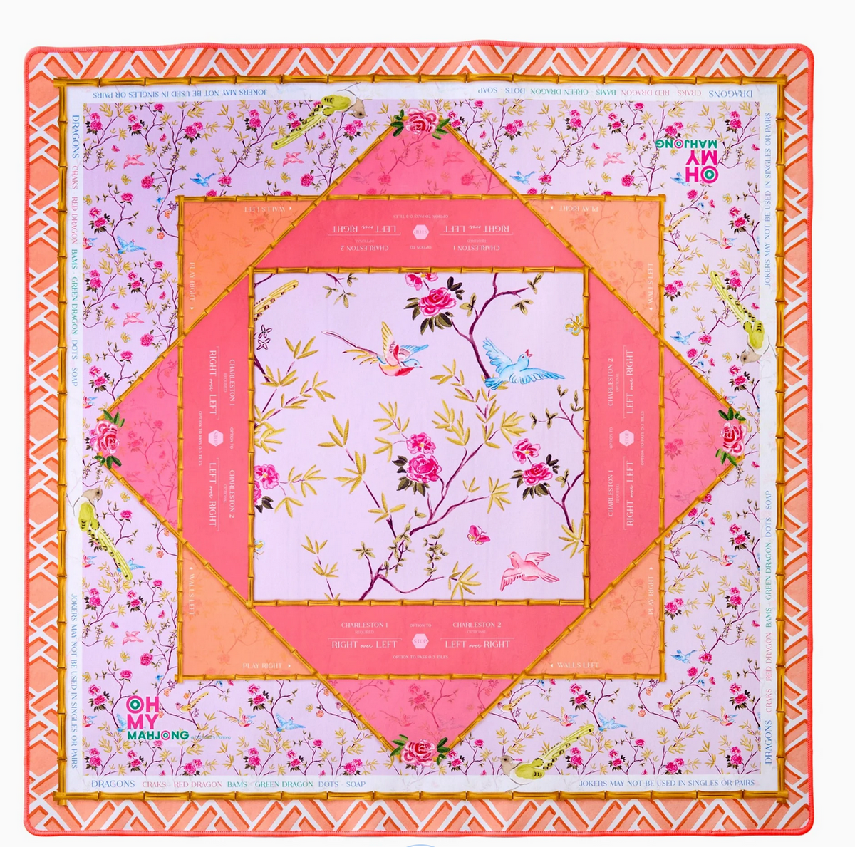 The Mahjong Mats by Oh My Mahjong feature a colorful non-slip surface with floral and bird designs in pink, orange, and gold, geometric borders, game markings, and the OH MY MAHJONG logo in two corners.