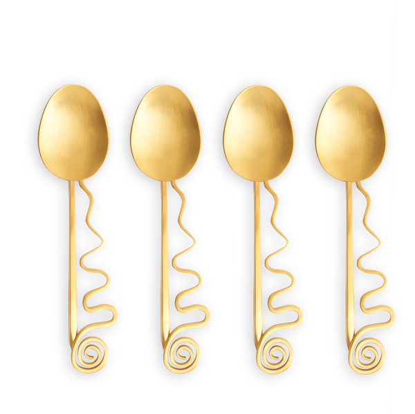 The Spirale Gold Cocktail Spoons Set of 4 by L'Objet features wavy handles with spiral ends and shiny 24k gold plating, arranged in a row on a white background.