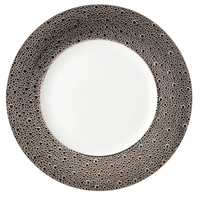 The Ecume Platinum Dinnerware by Bernardaud features a white plate with a textured gray and black rim, bringing elegance to any modern table setting.