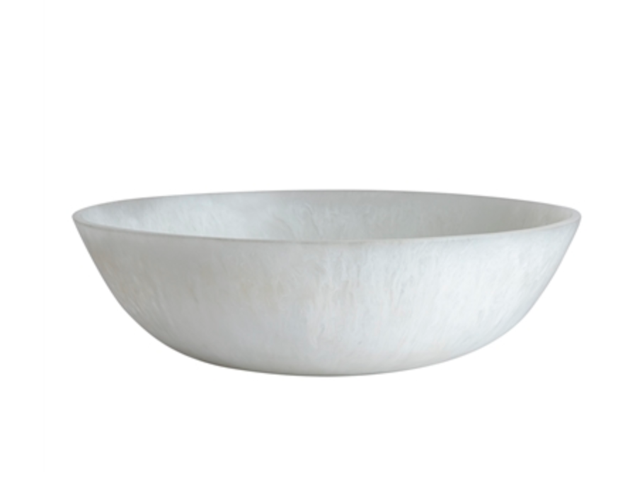 The Whitney Resin Bowl - White 19.5" by BIDK Home features a shallow, round design with a smooth matte finish, making it a striking decorative accent against a plain white background.