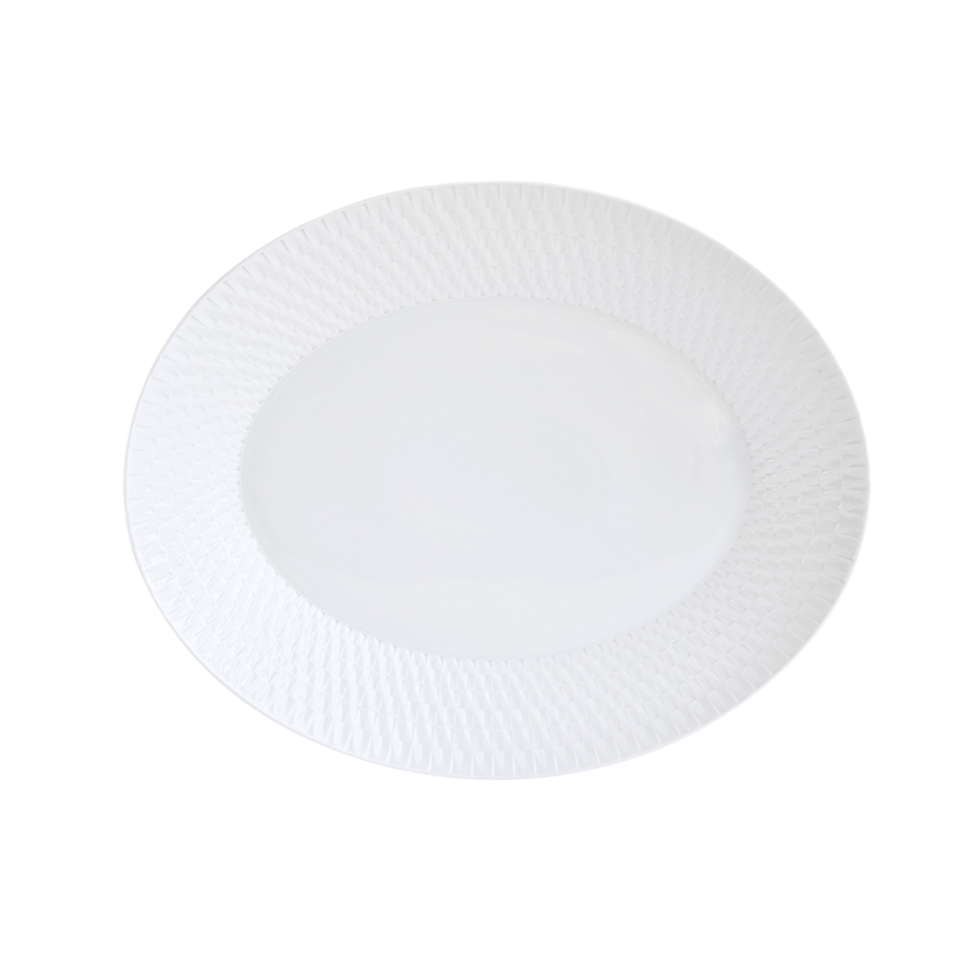 The Bernardaud Twist Oval Platter - 15" is a white ceramic plate with a geometric rim pattern and smooth center, shown on a plain white background.