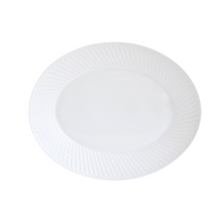 The Bernardaud Twist Oval Platter - 15" is a white ceramic plate with a geometric rim pattern and smooth center, shown on a plain white background.