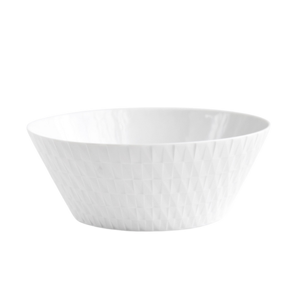 The Bernardaud Twist Salad Bowl - 10" is a white ceramic bowl featuring a subtle, origami-inspired geometric exterior pattern, displayed on a plain white background.
