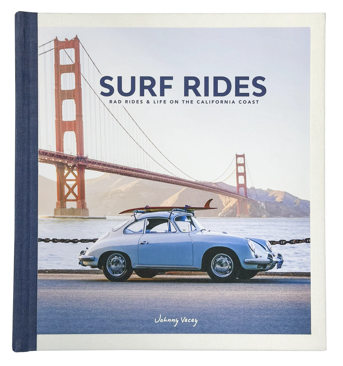 Book cover for Surf Rides by Johnny Vacay features a vintage blue car with a surfboard atop, highlighting rugged surf gear, parked near the Golden Gate Bridge under a sunny blue sky.