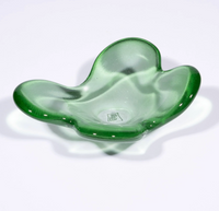 The Cloud Dish by Tyler Barry Design is a green, translucent hand-blown glass bowl with an abstract wavy shape and smooth surface, photographed on a white background—a striking decorative accent for any space.