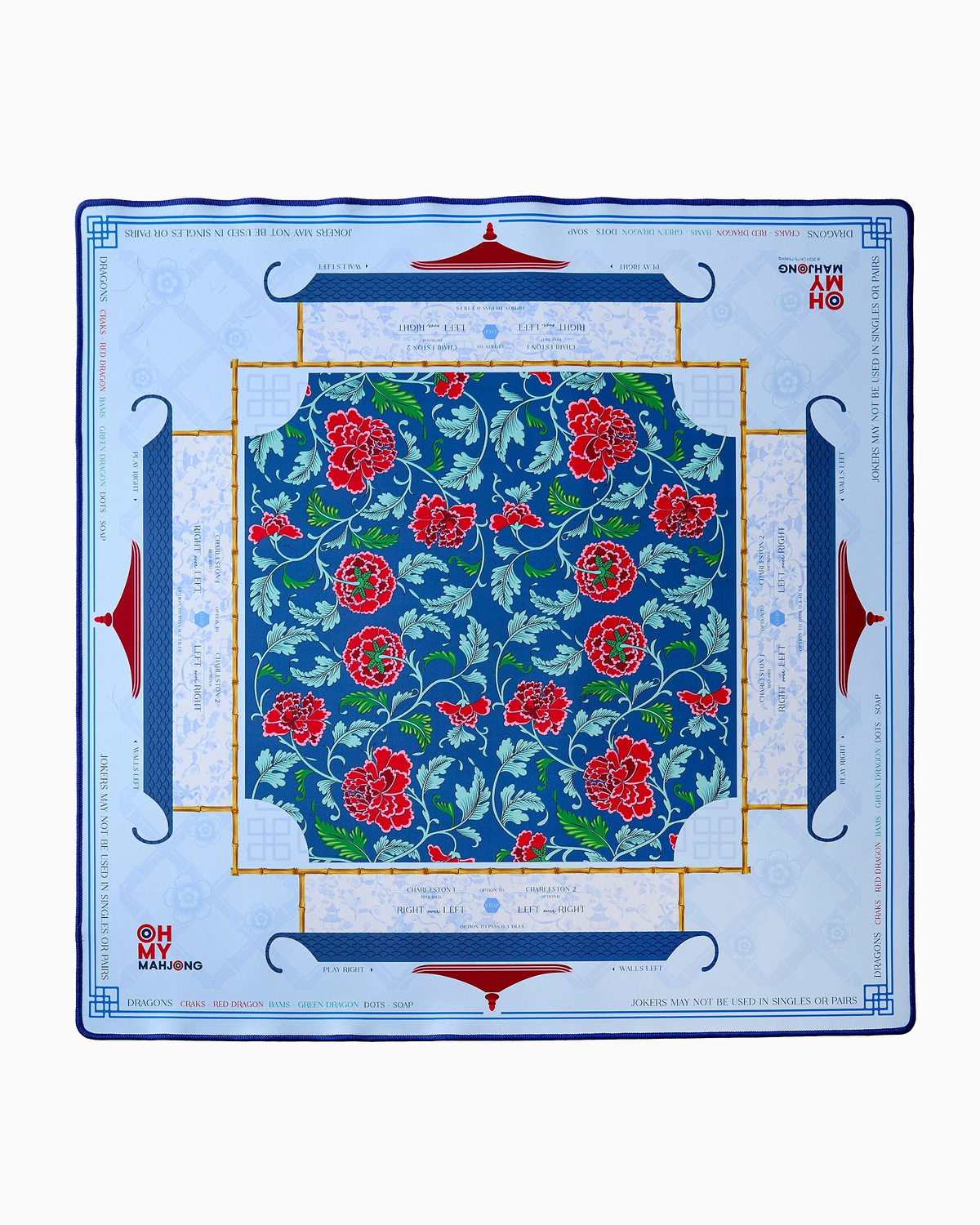 Oh My Mahjong’s Mahjong Mats feature a square neoprene design with a central blue floral pattern of red and pink flowers, a blue and gold border, and sections with light blue text and Mahjong motifs on white.