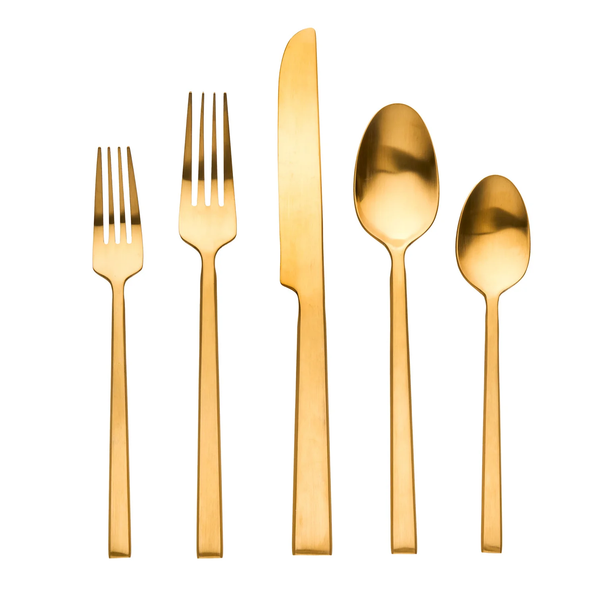 The Ricci Hover Flatware 5 Piece Setting in matte gold, featuring two forks, a knife, a tablespoon, and a teaspoon, is arranged in a row on a white background.