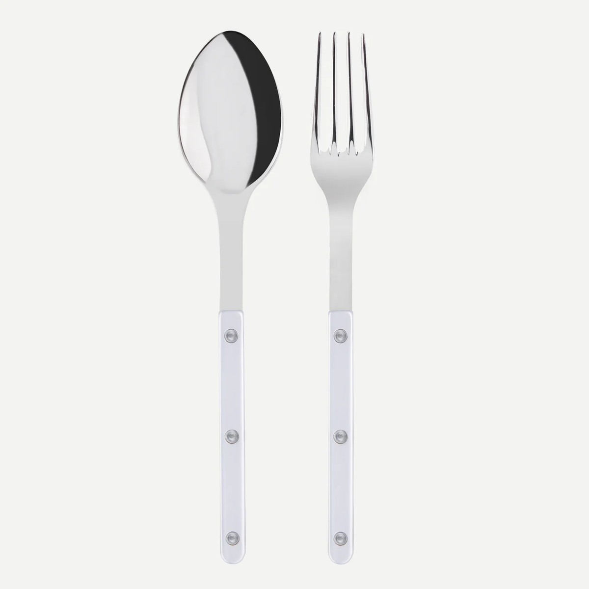 The Sabre Bistro Pearly Serving Set features a metal spoon and fork with white mother of pearl handles and three rivets, shown side by side on a white background—an elegant, customizable addition to any cutlery collection.