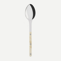 The Sabre Bistro Horn Serving Spoon, made in France, features a shiny oval stainless steel bowl and a light marbled handle with three metal rivets, displayed against a plain white background.