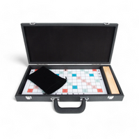 The Brouk & Co Onyx Scrabble Set features a luxe open carrying case displaying the board, black cloth tile bag, and wooden tile rack—perfect as a stylish travel game on any white background.