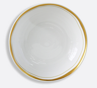 The Albatre Dinnerware - Gold by Bernardaud features a white alabaster plate with a shiny, uneven gold rim, shown from above on a light gray background—an elegant showcase of wabi-sabi style.
