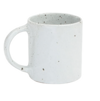The Marcus Dinnerware - White Salt Glaze set of 4 by Blue Pheasant features white ceramic mugs with black speckles and a handle, capturing artisanal charm and pairing perfectly with handcrafted dinnerware.