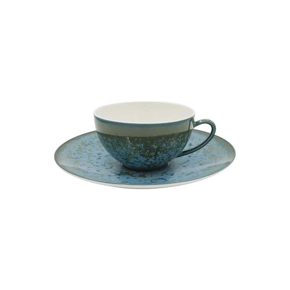 The Nymphea Dinnerware cup and saucer by Jaune De Chrome feature a speckled blue-green glaze with a rustic, handmade look and a light off-white cup interior. Made in France.