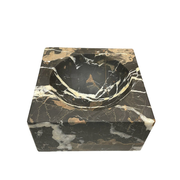 The Marble Square Black & Gold Bowl by Designs by Marble Crafter features a deep, round basin with striking black and gold veining—ideal as an ashtray or elegant accent piece.