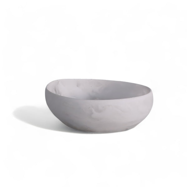 The Arila Small Bowl - White Swirl by Nashi Home is a round, light gray ceramic bowl with a smooth finish and subtle white swirl, ideal for coastal décor.