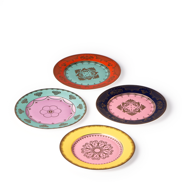 The Polspotten Grandpa Canape Plates Multi Set of 4 features porcelain side plates with ornate gold designs on white, each in a unique color—red, green, dark blue, and yellow—and arranged in a diamond shape.