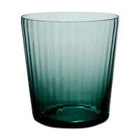 A Lando Pleat Glassware tumbler by MATCH, crafted from dark green transparent glass with vertical ridges, stands against a plain white background, its elegant form reflecting the artistry of antique Italian glass made using traditional Venetian techniques.