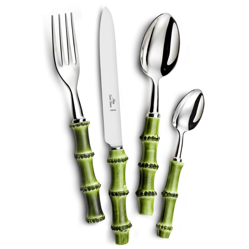 The Alain Saint-Joanis Bamboo Flatware 5 Piece Setting features stainless steel tops and green wood handles with a bamboo look, made in France for stylish dining. Includes fork, knife, soup spoon, teaspoon, and salad fork.