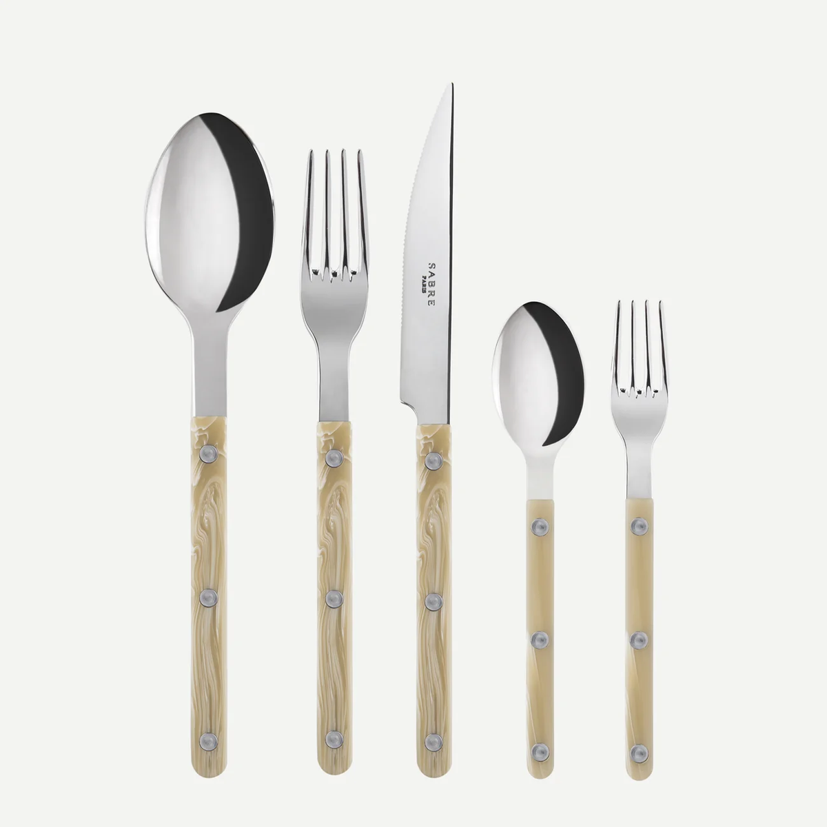 The Sabre Bistrot Solid Flatware 5 Piece Setting - Shiny features Paris-inspired beige-handled utensils with metal rivets. Includes a large spoon, fork, knife, small spoon, and small fork displayed on a white background.