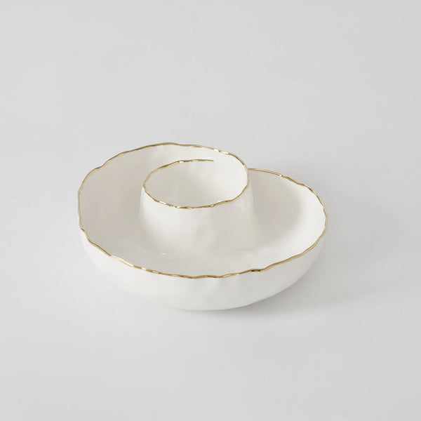 The PAMPA BAY Portofino Round Chip & Dip features a white porcelain spiral design with a wavy rim and thin gold trim, displayed on a plain white background.