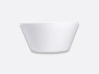 The Bernardaud Organza White Dinnerware features a textured, white Limoges porcelain bowl with sloping sides, centered on a light gray background—an elegant choice for minimalist interior décor.