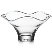 The Simon Pearce Chelsea Bowl is a handmade glass bowl with a wide, flared top, wavy-edged rim, and sturdy rounded base. The empty bowl is set against a white background.