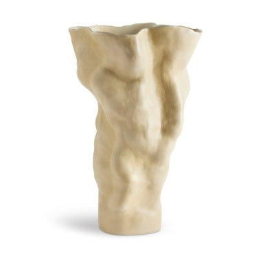 The Timna Vase Latte - Tall by L'Objet features a sculptural, abstract shape with a wavy texture and matte beige finish, inspired by ancient porcelain from the Arava desert. This ceramic vase stands upright for a striking display.